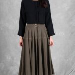 LOUISE midi skirt sewing pattern: straight-on view of the khaki skirt with front button placket and full flared hem.