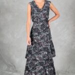 FOYS sewing pattern: front studio view of the FOYS maxi dress sewing pattern in dark multicoloured floral fabric, showing the sleeveless V-neck bodice, fitted waist and two flounces.