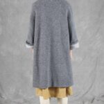 CHAMADE relaxed coat sewing pattern photograph emphasizing the roomy straight silhouette and V-shaped front opening of the drop-shoulder design.