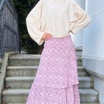 BOHEME bohemian maxi skirt photographed outdoors, with a flowing long silhouette and layered ruffles in a soft floral fabric.