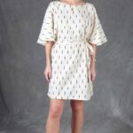 COSMOS batwing-sleeve tunic sewing pattern: wide integrated sleeves create the characteristic batwing outline. The tunic can be styled with or without the tie.