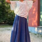 CALYS one-piece blouse sewing pattern photographed as a casual outfit, with wide short sleeves and an easy, softly draped fit.