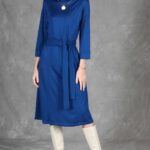 PALOMA blue midi dress sewing pattern: front-facing knit dress with a long tie belt and three-quarter sleeves.