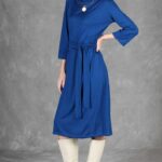 PALOMA dress sewing pattern with curved princess seams for a shaped bodice and a fabric belt at the waist.