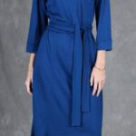 PALOMA knit dress sewing pattern with a higher round neckline, princess seams and waist tie.