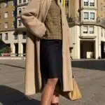 VIVIANE long coat sewing pattern: beige button-front coat with high neckline and softly flared lower shape, shown as an outerwear sewing sample.