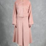THAIS Japanese-sleeve jacket sewing pattern — pink-toned patterned outer layer with integrated sleeves and a visible front zip, styled with the coordinating skirt.