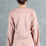 THAIS Japanese-cut jacket sewing pattern — the outer layer in a printed ensemble, illustrating the uninterrupted shoulder-to-sleeve shape and cropped proportions.