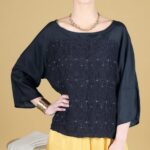 SONGE PDF top sewing pattern product image featuring a loose black blouse with a textured front panel, wide round neckline and Japanese-inspired three-quarter sleeves.