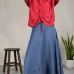 MAR gathered top sewing pattern: red blouse with central drawstring ruching worn with a long flowing blue skirt.