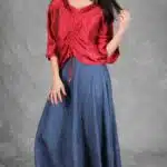 MAR blouse sewing pattern with front gathers: red drawstring top shown at a slight angle above a flowing blue skirt.