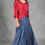 MAR relaxed gathered top sewing pattern: side-angle view of the red blouse with front ruching and a full blue maxi skirt.