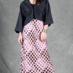 LORENA bias-cut maxi skirt sewing pattern: full-length front view of the pink animal-print skirt with a black cropped blouse.