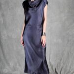 Model wearing a sleek bias cut dress made with a bias cut dress sewing pattern, featuring a satin finish and elegant drape.