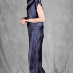 Model wearing a sleek bias cut dress made with a bias cut dress sewing pattern, featuring a satin finish and elegant drape.