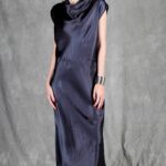 Model wearing a sleek bias cut dress made with a bias cut dress sewing pattern, featuring a satin finish and elegant drape.