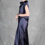 Model wearing a sleek bias cut dress made with a bias cut dress sewing pattern, featuring a satin finish and elegant drape.