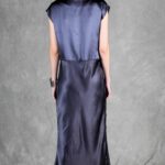 Model wearing a sleek bias cut dress made with a bias cut dress sewing pattern, featuring a satin finish and elegant drape.