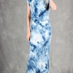 Model wearing a sleek bias cut dress made with a bias cut dress sewing pattern, featuring a satin finish and elegant drape.