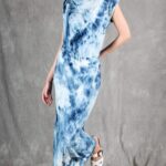 Model wearing a sleek bias cut dress made with a bias cut dress sewing pattern, featuring a satin finish and elegant drape.