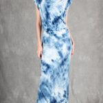 Model wearing a sleek bias cut dress made with a bias cut dress sewing pattern, featuring a satin finish and elegant drape.