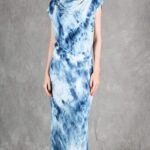 Model wearing a sleek bias cut dress made with a bias cut dress sewing pattern, featuring a satin finish and elegant drape.