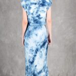Model wearing a sleek bias cut dress made with a bias cut dress sewing pattern, featuring a satin finish and elegant drape.