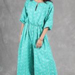 COLETTE wide-leg jumpsuit sewing pattern: green outfit with a fluid silhouette and Japanese-style sleeves.