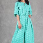 COLETTE jumpsuit PDF sewing pattern: green one-piece outfit with softly gathered waist and wide trousers.