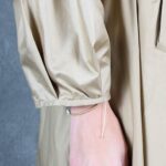 BLIZZARD hooded raincoat sewing pattern – garment photo for beige belted raincoat; women’s outerwear sewing project.
