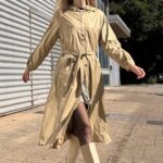 BLIZZARD hooded raincoat sewing pattern – pattern cover artwork for beige belted raincoat; women’s outerwear sewing project.