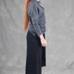 LE SILENCE DU VENT wide-leg pants sewing pattern with skirt overlay: side profile of the black asymmetric draped panel.