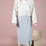 GRACE pencil skirt sewing pattern — PDF pattern cover for the asymmetric GRACE pencil skirt, featuring its tailored midi silhouette and slit details.
