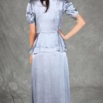 Sophisticated silver event dress with retro-inspired pintuck bodice and layered peplum, made with an event dress sewing pattern