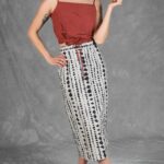 CHARLIZE midi skirt sewing pattern: front view of a high-waisted black-and-white patterned skirt with patch pockets.