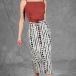 CHARLIZE high-waisted midi skirt sewing pattern: black-and-white patterned skirt shown while walking.