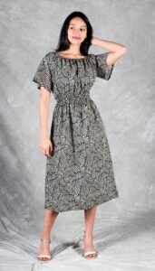 Woman wearing black and white gathered midi dress – Dune easy dress sewing pattern PDF