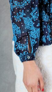 Close-up of cuff opening with fabric-covered button – wrist detail of the Agathe blouse sewing pattern