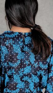 Back view of the Agathe blouse, with keyhole closure and puffed shoulders – feminine blouse sewing pattern with back detail