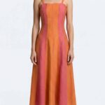 Model wearing a dress made from the DOMITIA sewing pattern: a concealed side zip keeps the waistline and side seam neat. The clean seams give the dress a tailored look.