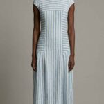 BELLA summer dress sewing pattern: blue-and-white striped dress showing the fitted bodice and long vertical skirt panels.