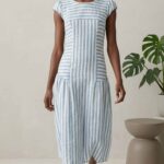 BELLA cap-sleeve dress pattern: front view of the blue-and-white striped dress, showing the shaped waist seams and paneled skirt.