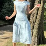 BELLA cap-sleeve dress sewing pattern reference image, featuring curved bodice panels, a shaped waist and gathered skirt inserts.