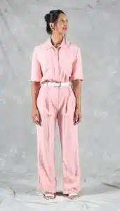 Handmade belted jumpsuit in pastel pink linen with cuffed short sleeves and wide-leg trousers – sewn using a shirt collar jumpsuit sewing pattern for confident makers.