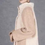 Side view of the JOY high-neck jacket sewing pattern, showing its relaxed raglan sleeve and raised collar.
