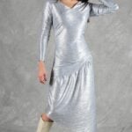 HYPE dress sewing pattern: silver long-sleeved dress with a draped skirt and waist gathers, three-quarter view
