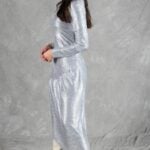 HYPE dress sewing pattern: silver long-sleeved dress in side view, showing the draped long skirt