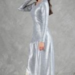 HYPE dress sewing pattern: side view of the silver long-sleeved dress with an asymmetric skirt.