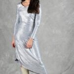 HYPE dress sewing pattern: three-quarter view of the silver long-sleeved dress with gathers and a draped skirt.