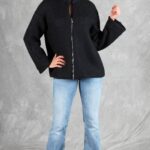 LYNN casual jacket sewing pattern: front view of a loose black zip-front jacket worn with light blue jeans.